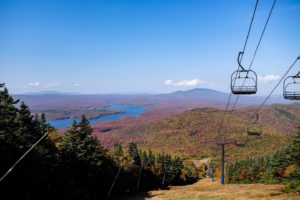 Ski lift in autumn with trees changing color.