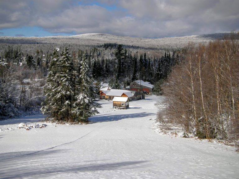 Wood cabins during the winter with snow. Prospect Mountain Nordic Center.
