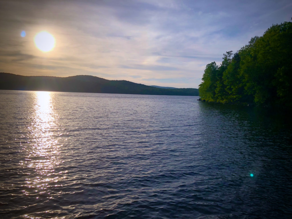 Lake with sun at sunset.